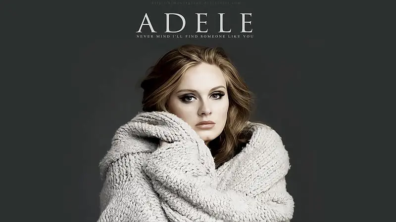 Adele, the British singer-songwriter, performing live with her powerful and emotional vocals.