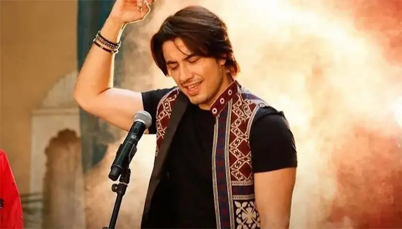 Ali Zafar, Pakistani singer, songwriter, and actor, performing live on stage.