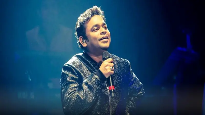 A.R. Rahman performing live on stage in front of a cheering audience