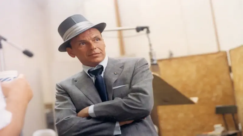 Frank Sinatra, iconic American singer and actor, known for timeless hits like My Way and Fly Me to the Moon.